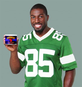 Greg Jennings holding tin of Omanhene Hot Cocoa Mix